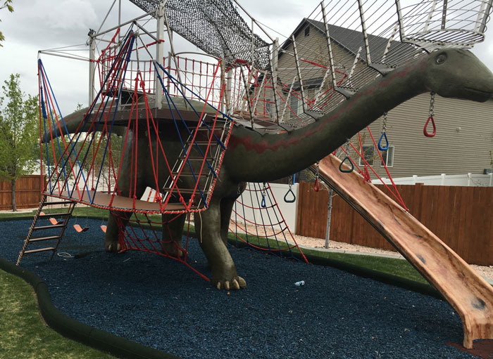 This Dad Should Win An Award For Building An Incredible 14-Meter Dinosaur Jungle Gym For His Kids