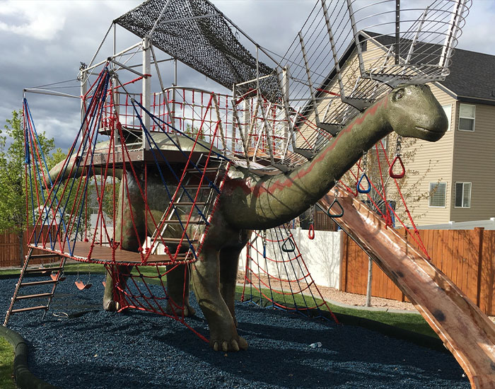 This Dad Should Win An Award For Building An Incredible 14-Meter Dinosaur Jungle Gym For His Kids