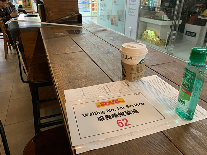 Every Other Seat At Starbucks Taped Off, Hong Kong