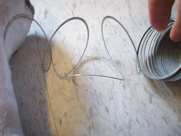 Twist A Knotted Slinky Counter To The Knot, Then Twist Back The Opposite Direction To Quickly Fix A Messed Up Slinky
