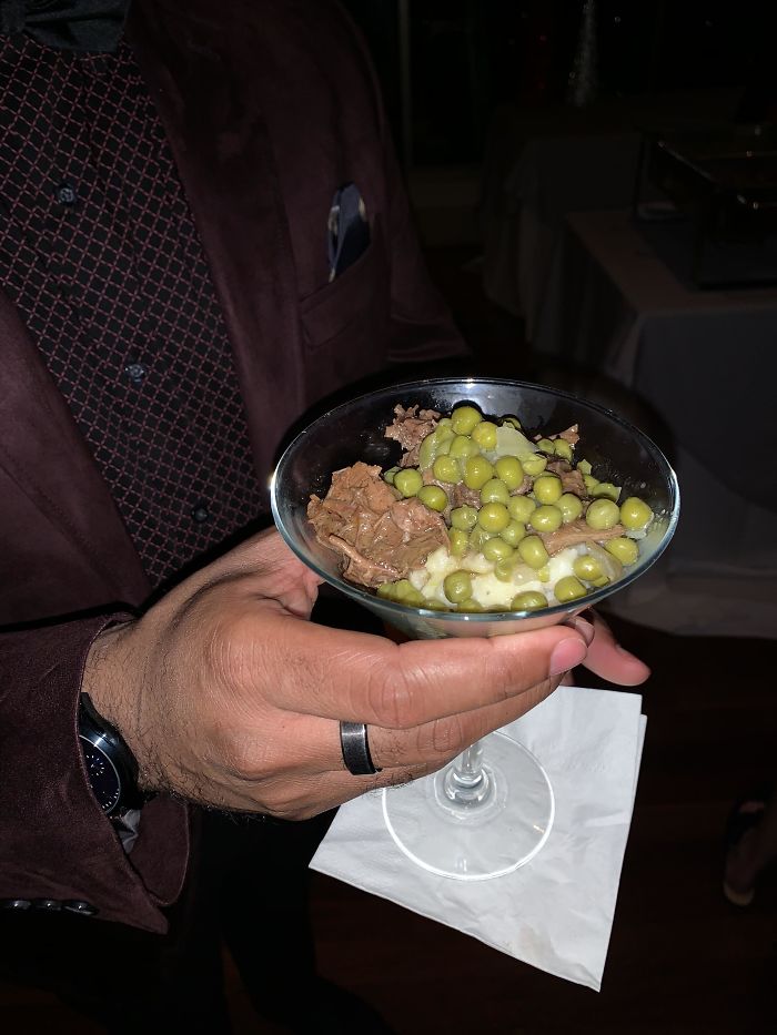 Dinner At A Corporate Christmas Party. Mashed Potatoes, Roast Beef, And Peas In A Martini Glass