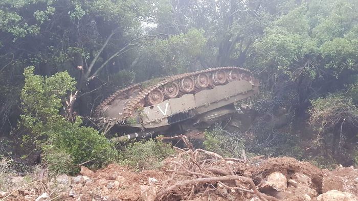 Tank Flipped From A Landslide Into The Woods.