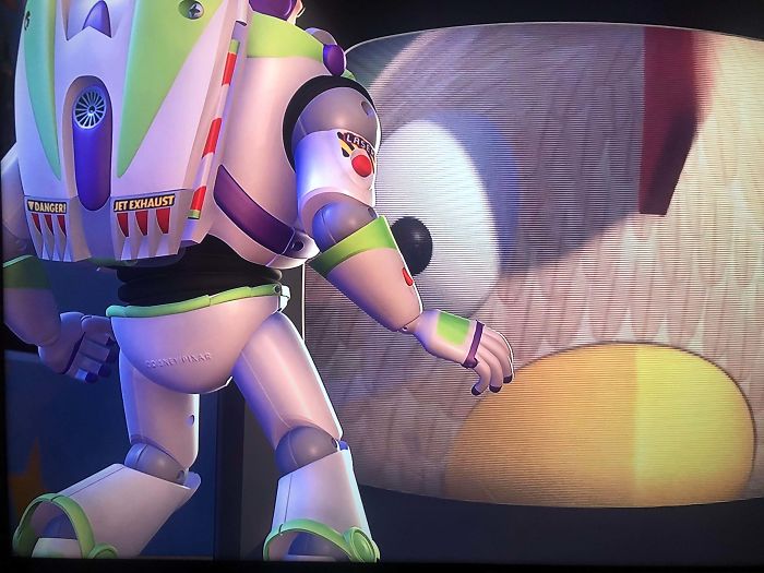 In Toy Story 2 (1999), When Ham Is Flipping Through Channels Trying To Find The Chicken Man, There’s A Little Copyright Stamp On Buzz Lightyear’s Behind