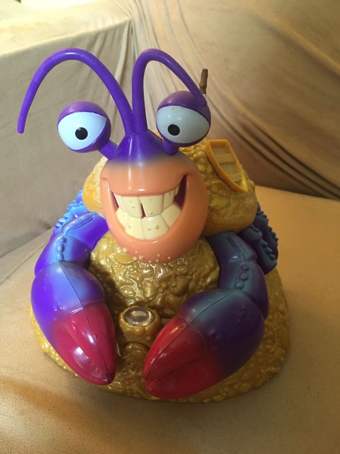 This Is My Tamatoa Jewelry Box. The Button To Open It Is Between His Claws. The Thing On Top Of It Is A Ring. Yes, It Plays Part Of "Shiny"