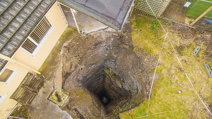 A Massive Mineshaft Opens Up Under A Garage At A House In Scorrier Near Redruth In Cornwall