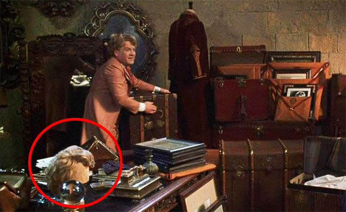 In The Chamber Of Secrets, You Can Spot Gilderoy Lockhart's Second Wig On His Desk