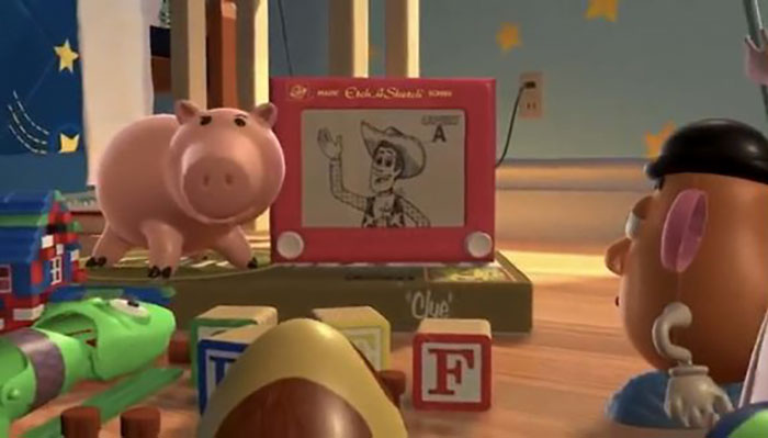 In Toy Story 2 Hamm Is Reviewing Clues To Find Woody... While Standing On A “Clue” Board Game Box