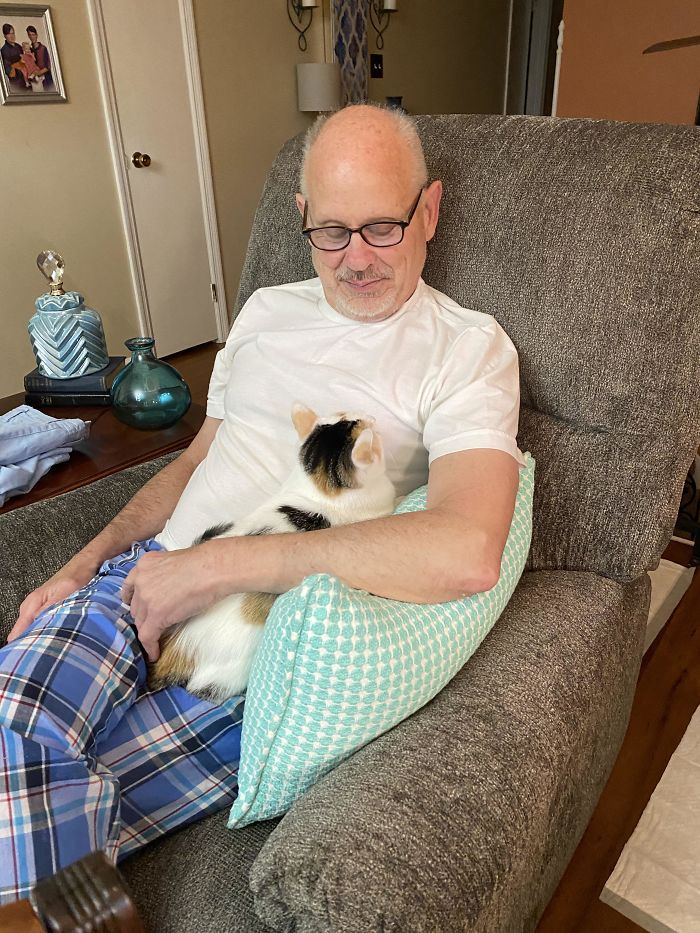 My Dad Rocking The Cat Who Wasn’t Allowed In “His Chair” That He Said He Did Not Want In His Chair Looking Pleased As A Peach