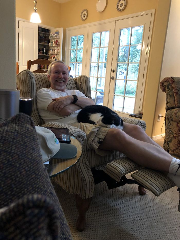 Dad Who Did Not Want A Cat Tearing Up In Joy Because The Cats On His Lap