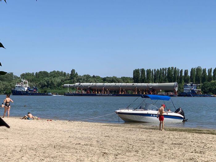 An Unknown Rocket-Like Object Is Being Transported By A Barge Along The Don River, Russia