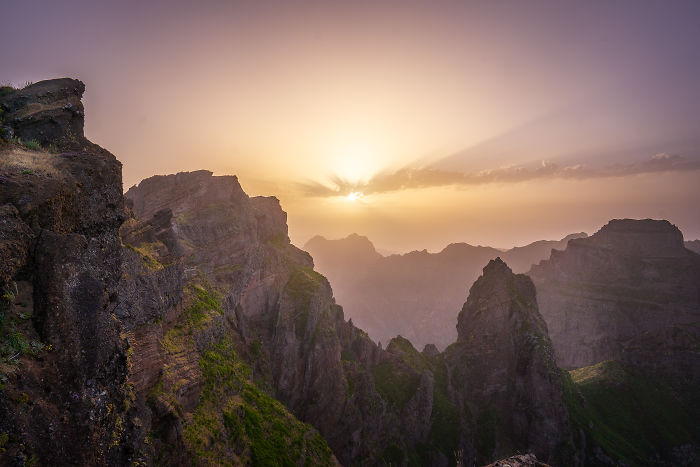 Sunset over rugged mountain peaks in Madeira, showcasing the island's magical and exciting natural beauty.