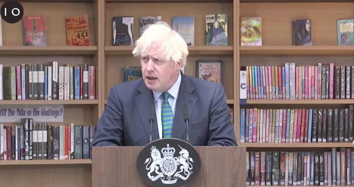 People Notice A Very Specific Book Arrangement Behind Boris Johnson During His Speech, Think The Librarian Did It