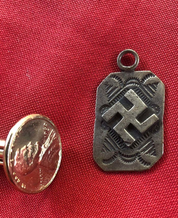 Reverse Swastica Neckless Tag. Found With Some Of My Great Uncles Things. He Was Born Around 1920 In Chicago. His Parents Were Born In Germany. Why Is This Reversed And Rotated?