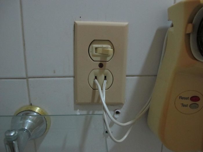The Way This Hairdryer Is Plugged In The Bathroom In A Hotel In Cuba
