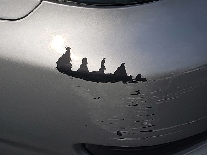 The Scratch On My Mom's Car Looks Like 4 People On A Canoe