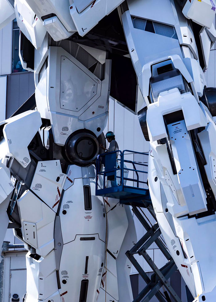 Guy Working On Japan's Giant Gundam Looks Like A Scene From A Movie