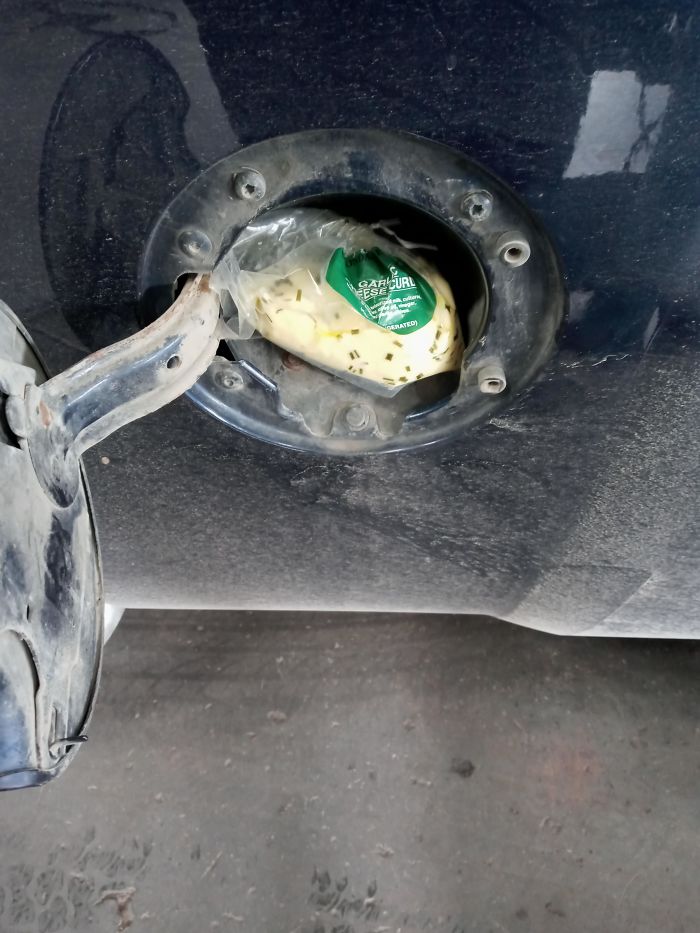 This Guy Crammed A Bag Of Garlic Cheese Curd Inside The Fuel Filler Door On Top Of The Gas Cap. Either He Though That Would Fix His Evap Leak, Or Lactose Intolerant Vampires Kept Syphoning His Fuel