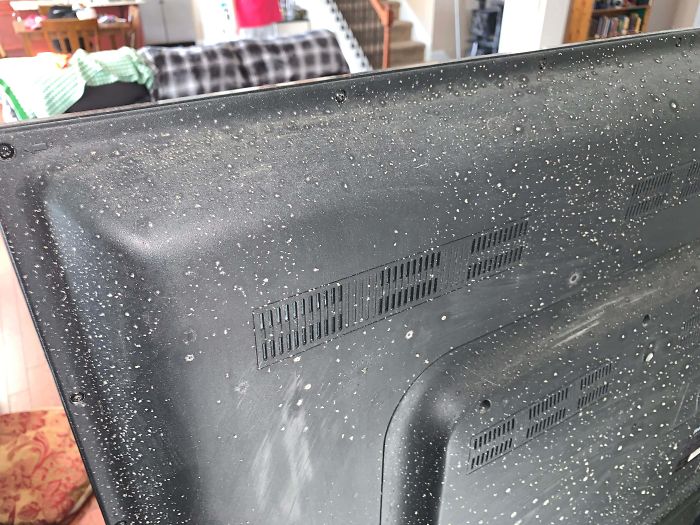 What Is This? White Particles On Back Of TV. Found No Where Else In Home, Not Even On Surrounding Furniture/Wall. Cleans Off But Reappears After A Few Weeks.