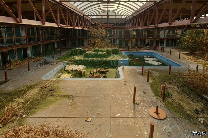 Pool Being Swallowed By Ivy Inside The Abandoned Days Inn Hotel In PA