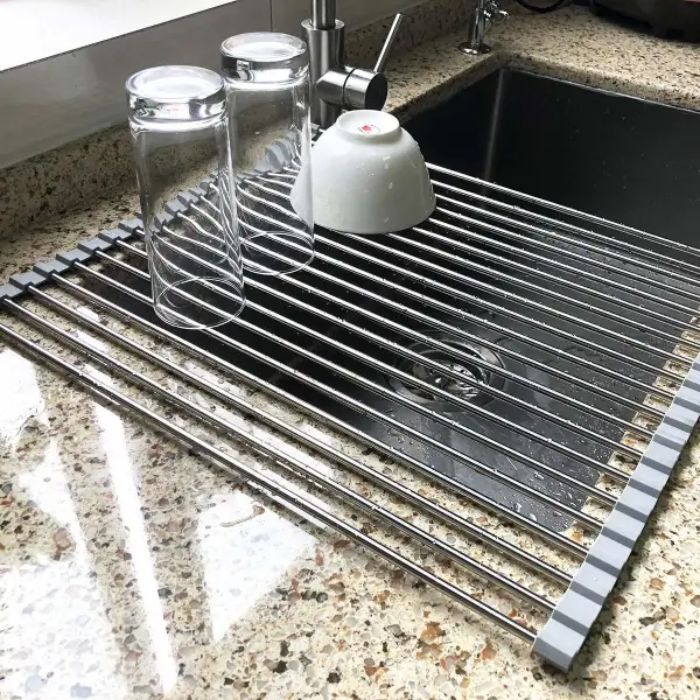 A Drying Rack That Rolls Out To Sit Over Your Sink