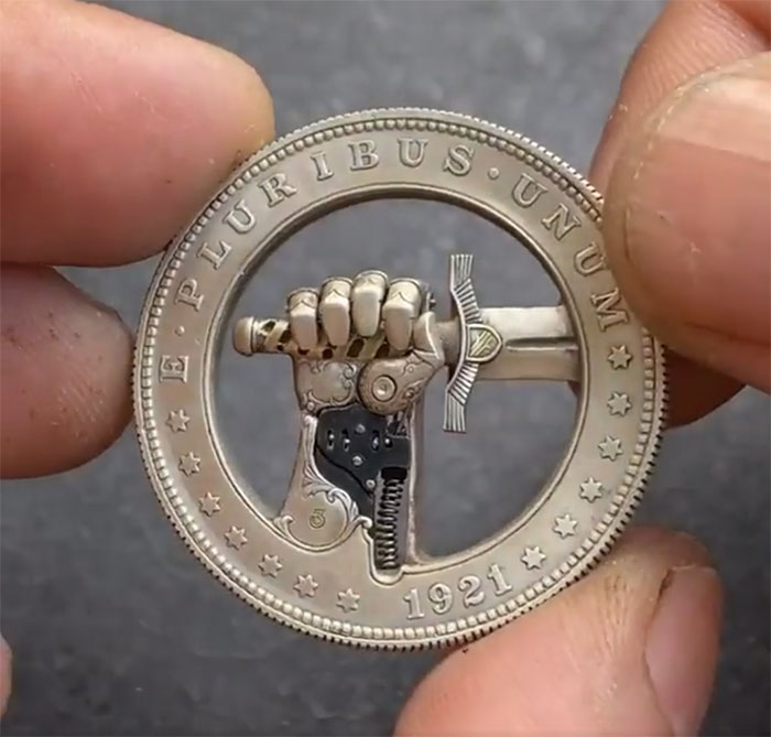 A Modified Us 1 Dollar Coin With A Hidden Button For Clasping And Unclasping A Sword