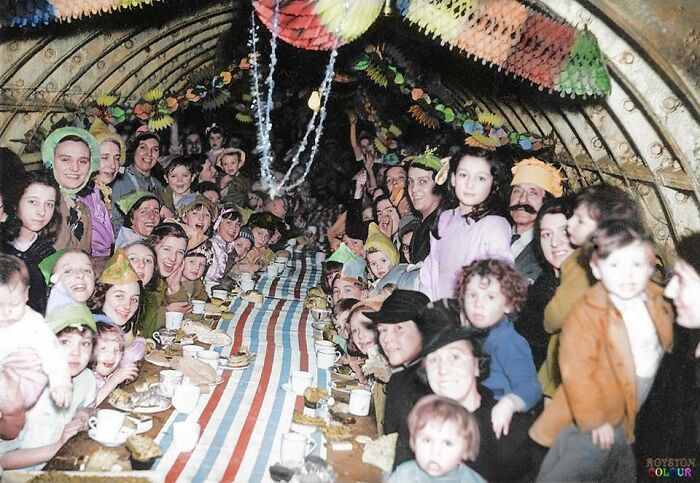 London Children And Their Families, Celebrating Christmas Day In An Underground Shelter. December 25 1940.