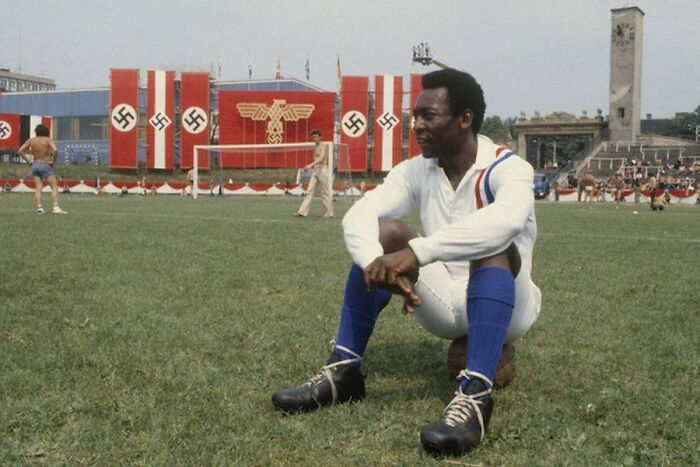 Pelé Takes A Break During The Filming Of Escape To Victory – In The Stadium Of A Jewish Team Filled With Nazi Flags In A Communist Country In 1981