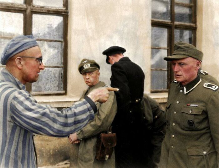 Russian Inmate Points An Identifying And Accusing Finger At A Nazi Guard Who Was Especially Cruel Towards The Prisoners In Buchenwald Camp