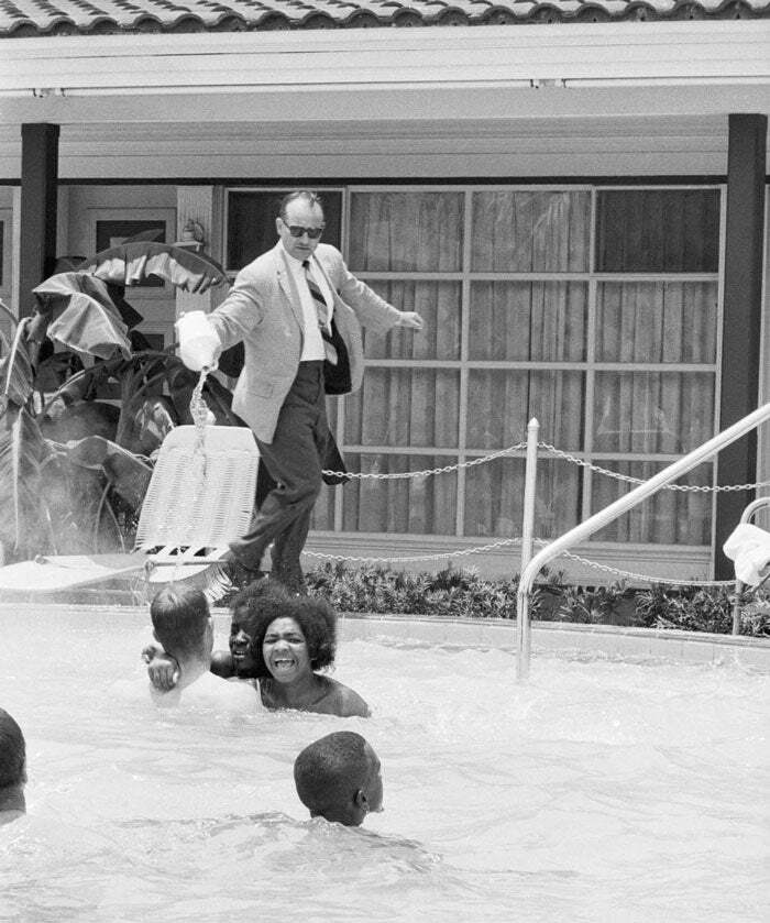 Motel Manager James Brock Pours Muriatic Acid In The Monson Motor Lodge Swimming Pool, To Get Black Swimmers Out Of The Pool. June 18, 1964