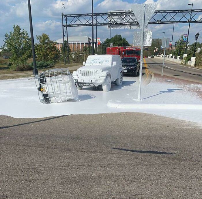 A Truck Carrying A Tank Of White Paint Dropped It On The Road