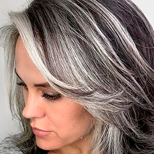 Instead Of Covering Grey Roots, This Hair Colorist Makes Clients Embrace It