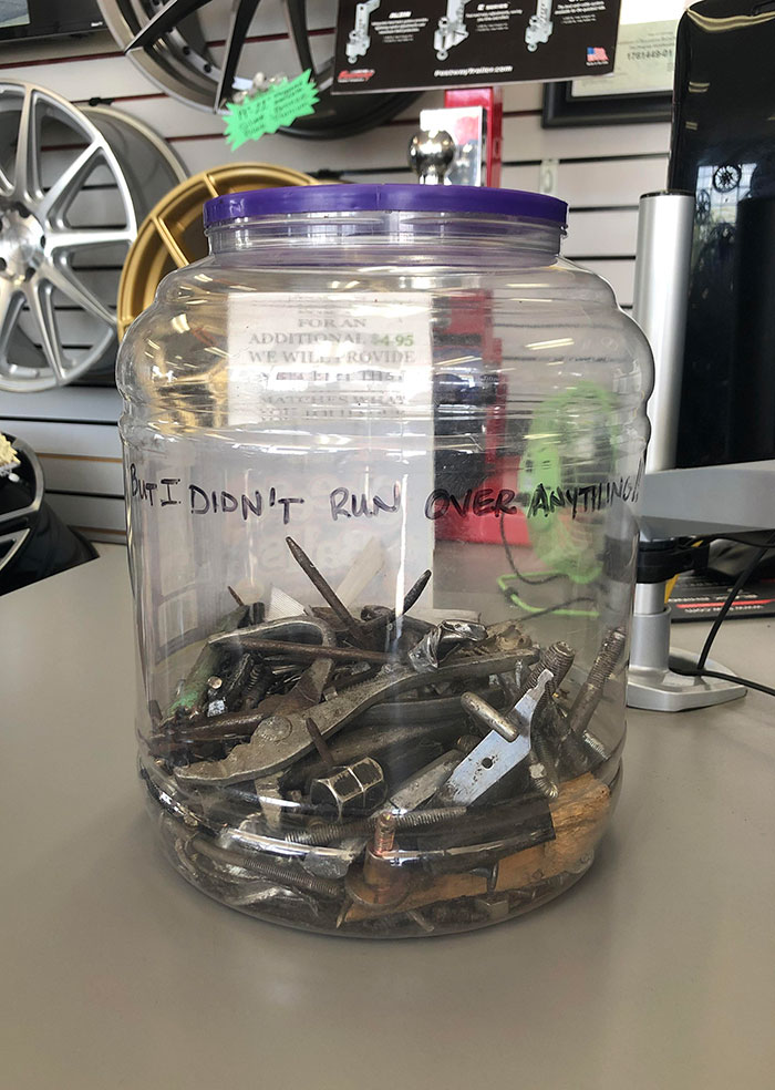 Local Tire Shop Has A Jar Full Of Various Things They’ve Found Inside Of Popped Tires