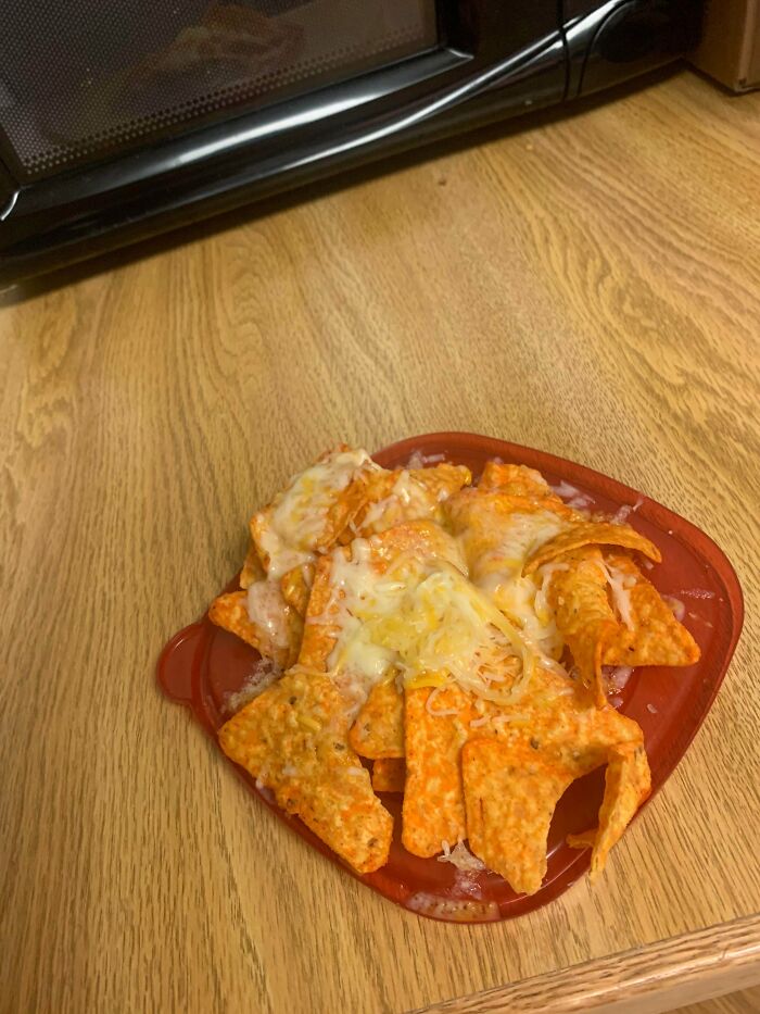 Doritos And Kraft Shredded Cheese Microwave And Served On A Tupperware Lid
