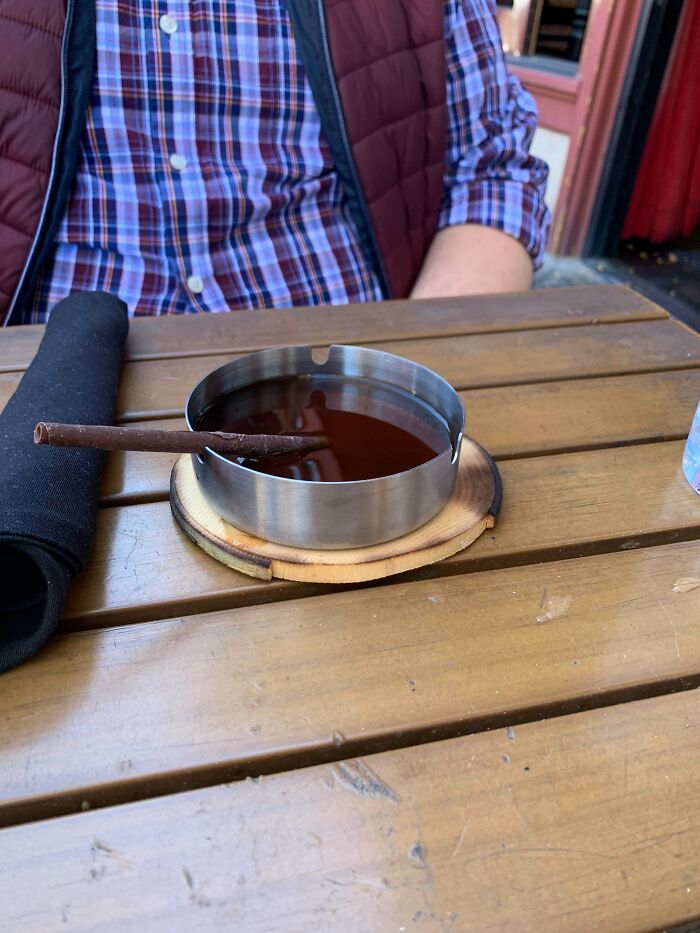 This Drink Was Called The Almost Famous. The Coffee Butters Tasted Like Ash Tray. When He Put The Ash Tray To His Mouth The Drink Leaked From The Holes Meant To Hold Cigarettes