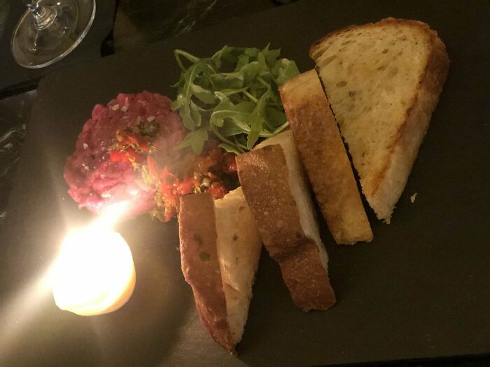 Steak Tatar Served With A Beef Fat And Butter Candle That You Have To Wait To Melt Before You Can Properly Mix In And Eat With