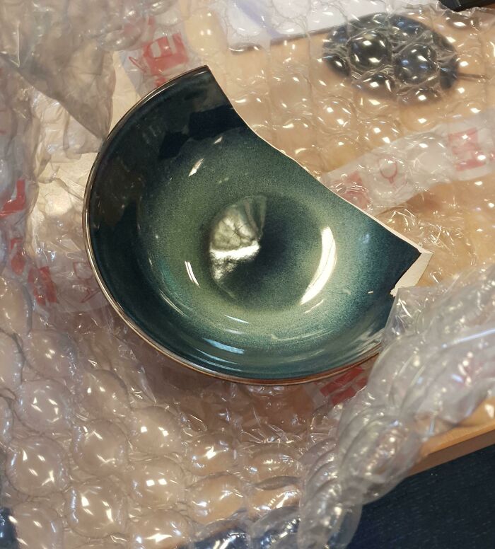 My Colleague Ordered Some Bowls Online And This One Came Exactly As You See It. Someone Wrapped A Broken Bowl, Without The Parts That Broke Off, Meaning It Didn't Break In Transit