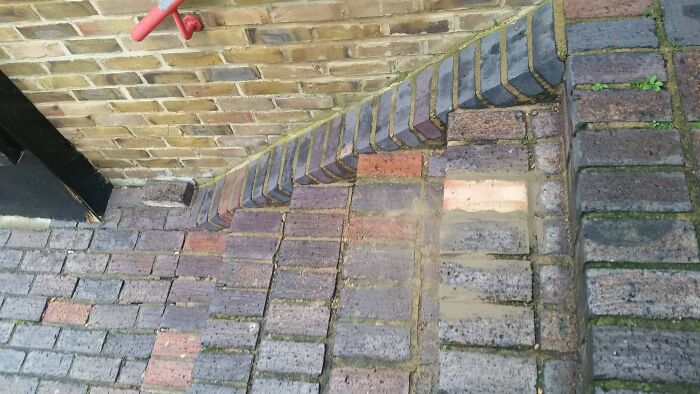 Loose Brick Replaced By A Different Colour, While The Original Is Right There At The Bottom