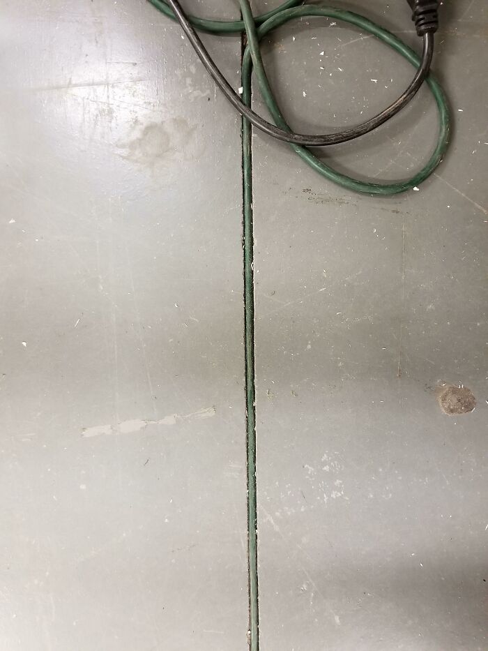 Extension Cord Fits Perfectly In Crack At Work