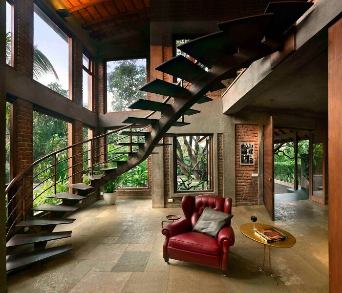 Unique Entrance To A Brick Residence Surrounded By Old Mango Trees Featuring A Twisting Steel Staircase In Alibag Near Mumbai, India
