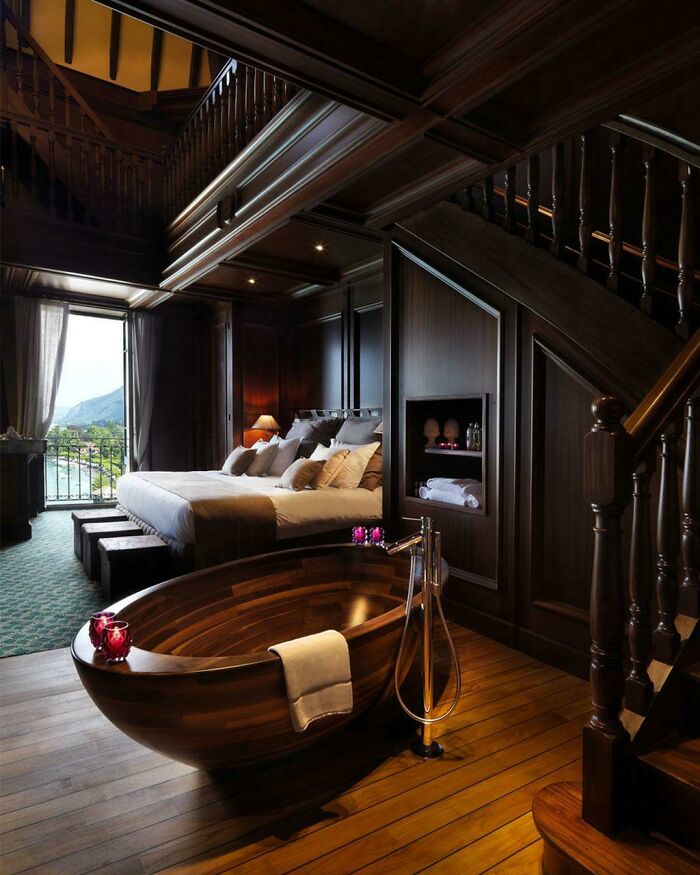 A Dark And Elegant Bedroom Suite Nestled Under The Stairs