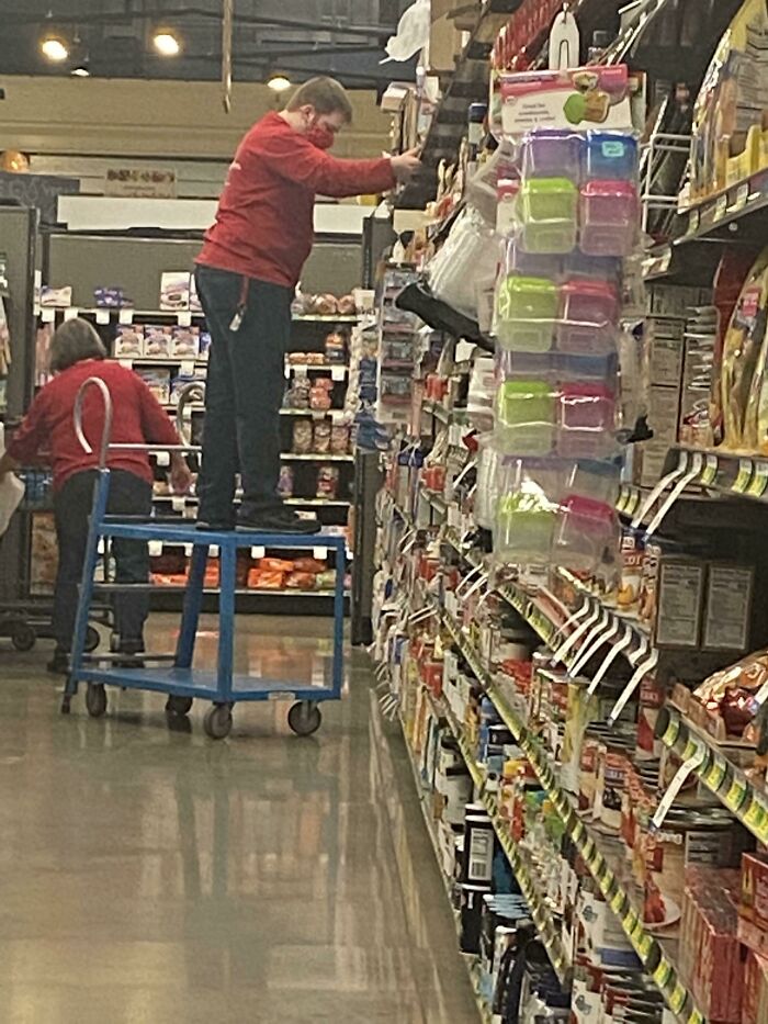 And He’s Pulling On The Shelves To Move Himself Down The Aisle