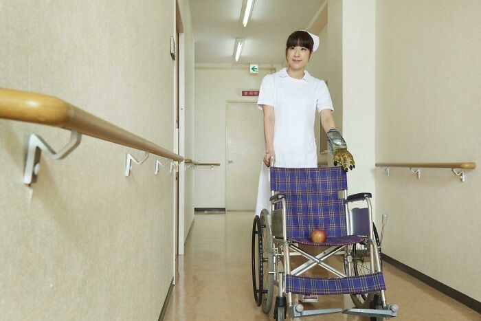 Japanese Dragon Nurse Helps Apple With A Wheel Chair