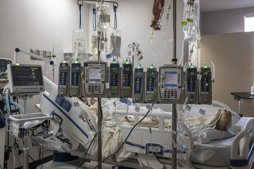 Iv Pumps And Electrocardiogram Machines Are Seen In A Patient's Room In The Covid-19 Intensive Care Unit On Dec. 7 In Houston