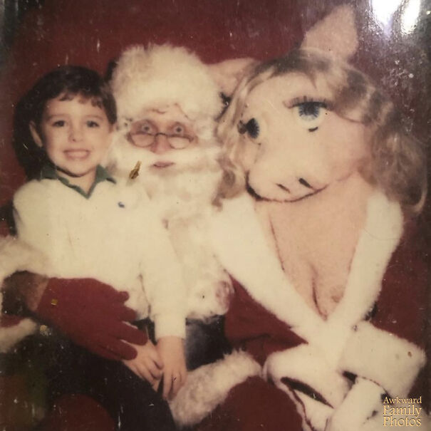 Just A Good Old Holiday Pic With An Innocent Little 4-Year-Old, A Creepy Santa And A Scantily Dressed Miss Piggy! Even More Disturbing, Why Does The Costume Even Have Those Body Parts Sewn On?!