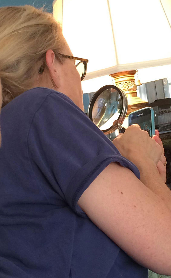 My Mom Using A Magnifying Glass To See My Phone Better. Love Her To Death But She's Not The Best With Technology