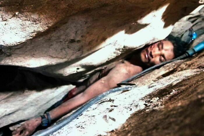 Poor Cambodian Guy Was Trapped Like This For Four Days After Slipping While Alone In The Jungle. After Finding Him, It Took Ten Hours Of Chipping Away At The Rock To Free Him. He's Alive And Now Recovering In Hospital.