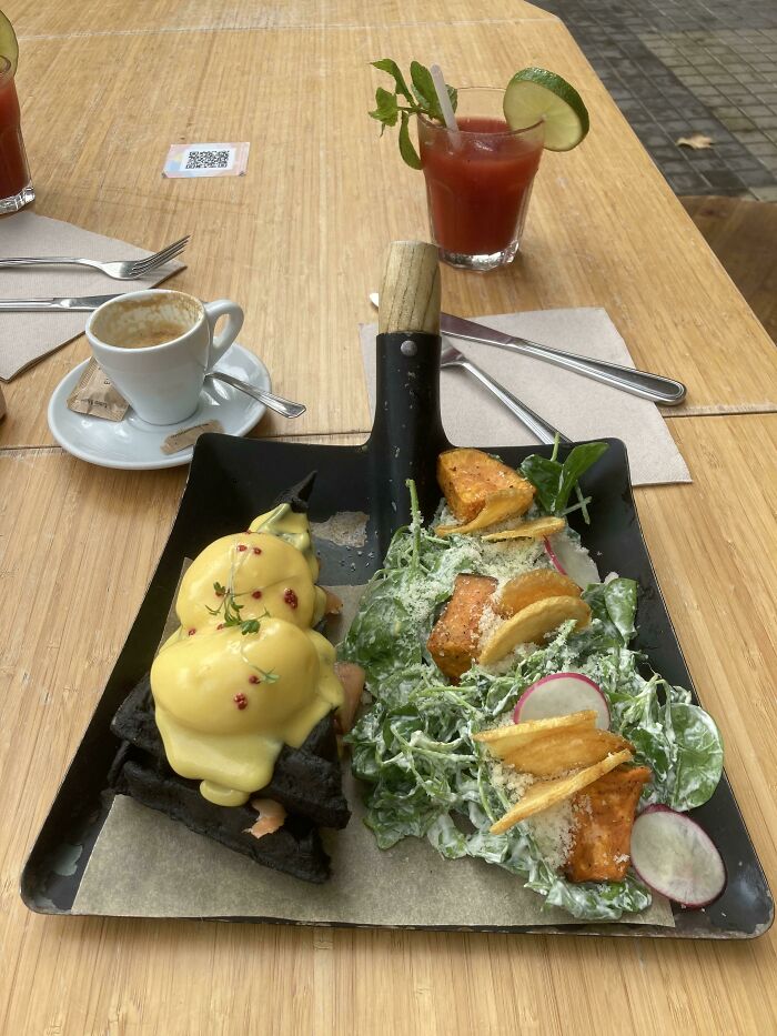 Charcoal Waffle Eggs Benedict On A Shovel In Barcelona