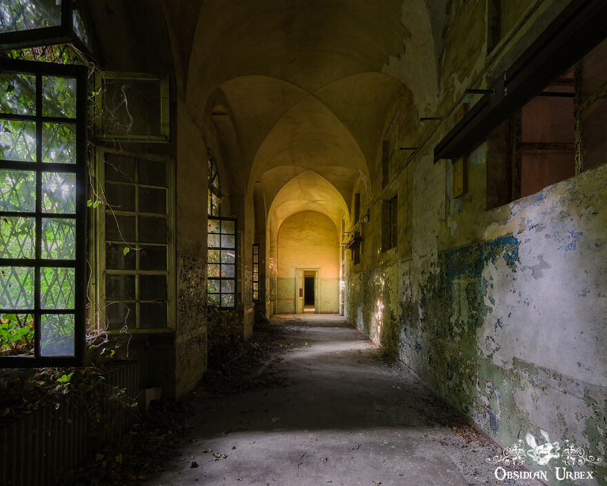 A Dark And Foreboding Corridor Of A Decaying Mental Asylum