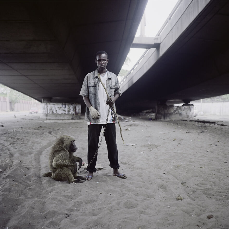 Animal Handler With Ajasco, Lagos, Nigeria, 2007, "The Hyena And Other Men"