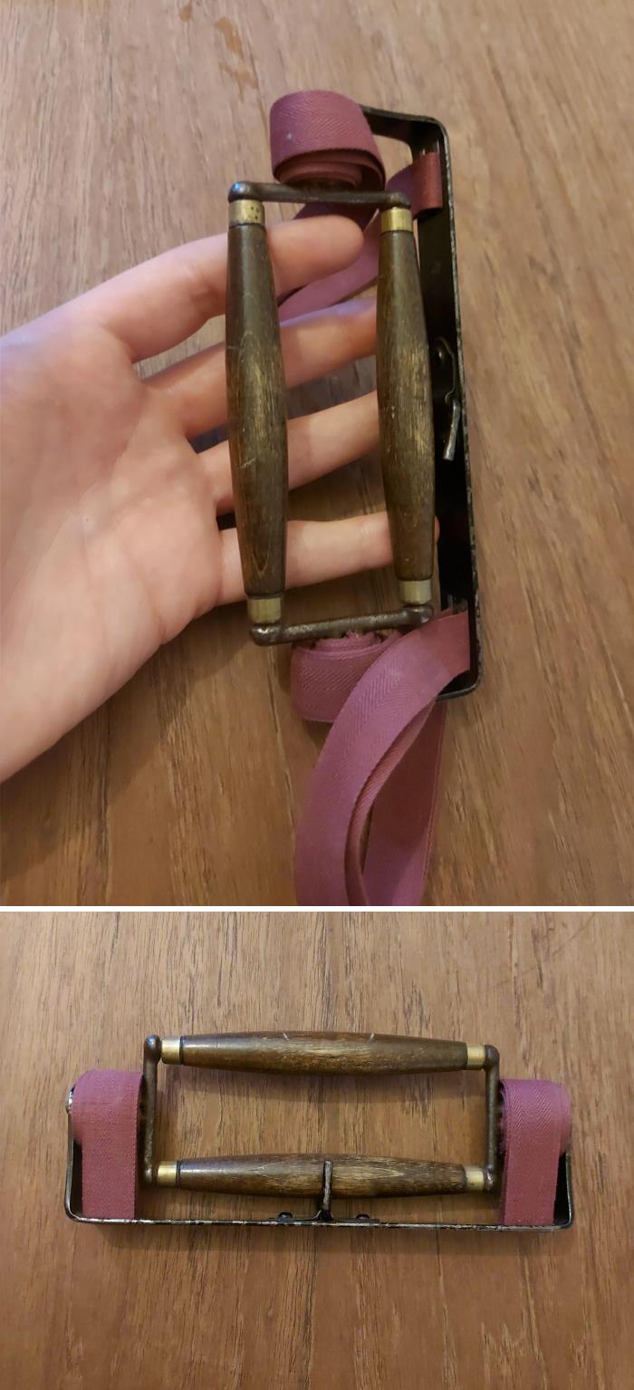 This Was Found With Old Tools. Doesn't Seem To Attach To Anything. It Can Lock In Place And The Middle Bit Turns Round, Unravelling Two Straps Of Fabric. I'm Stumped!